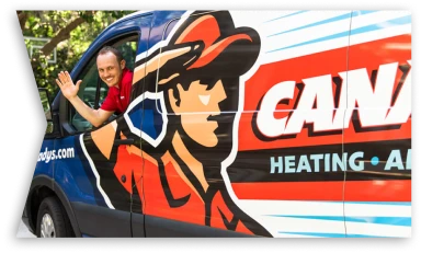 Canady's technician waving from a service truck