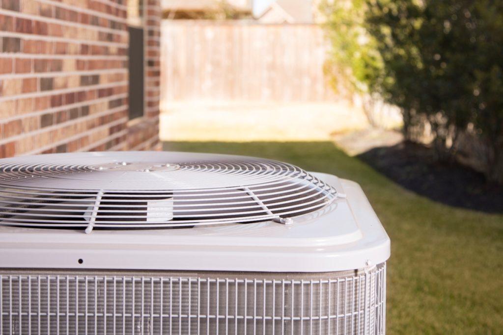 Closeup of air conditioner outside a home